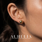 Mocha Crystal Pearl Stud Earrings worn by a model