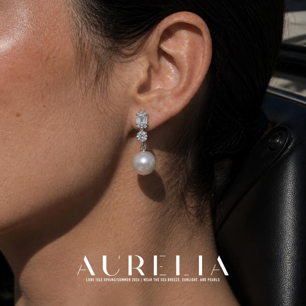 Round Shell Pearl Drop Earrings worn by a model