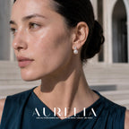 Close portrait with clear-accent stud above a white round bead at the ear.