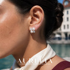 Close view of the four-part cluster worn on an ear.