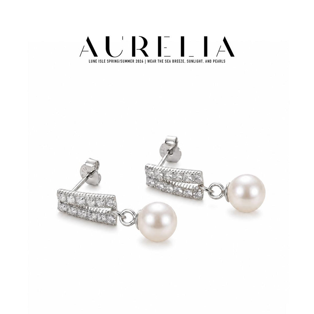 Silver-tone still shows paired straight clear-set bars, a short connector ring and single white round drop.
