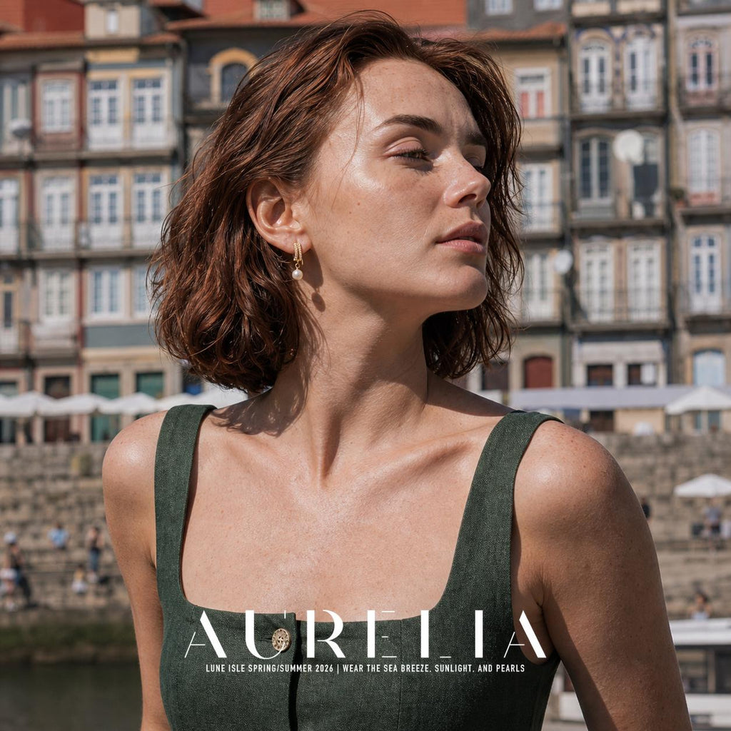 Wider outdoor portrait in a dark green sleeveless top with the paired bar and white drop visible.
