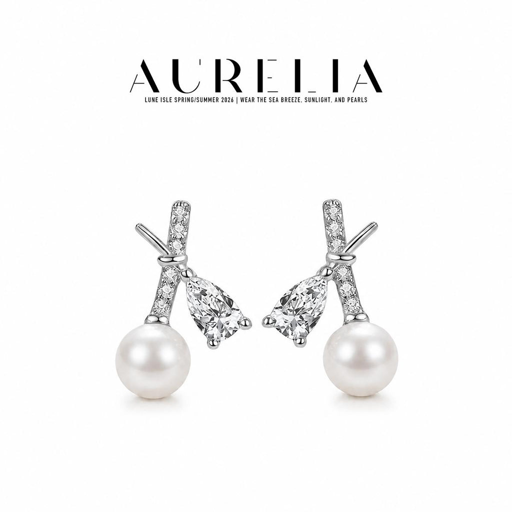 Silver-tone standalone crossed-bar pair with separate pear-shaped clear accents and white round beads.