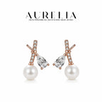 Crossed Bar Pearl Stud Earrings — supplied AURELIA product photograph.