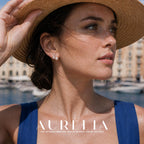 Straw-hat portrait retains the crossed upper bars, clear pear accent and round white bead.