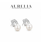 V-Shape Shell Pearl Stud Earrings — supplied AURELIA product photograph.