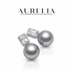 Standalone gray-bead pair with rectangular clear centers and matching small-stone halos.