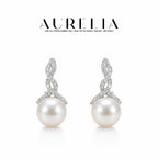Twist Shell Pearl Stud Earrings — supplied AURELIA product photograph.