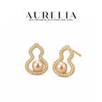 Curved Pearl-Accent Stud Earrings — supplied AURELIA product photograph.