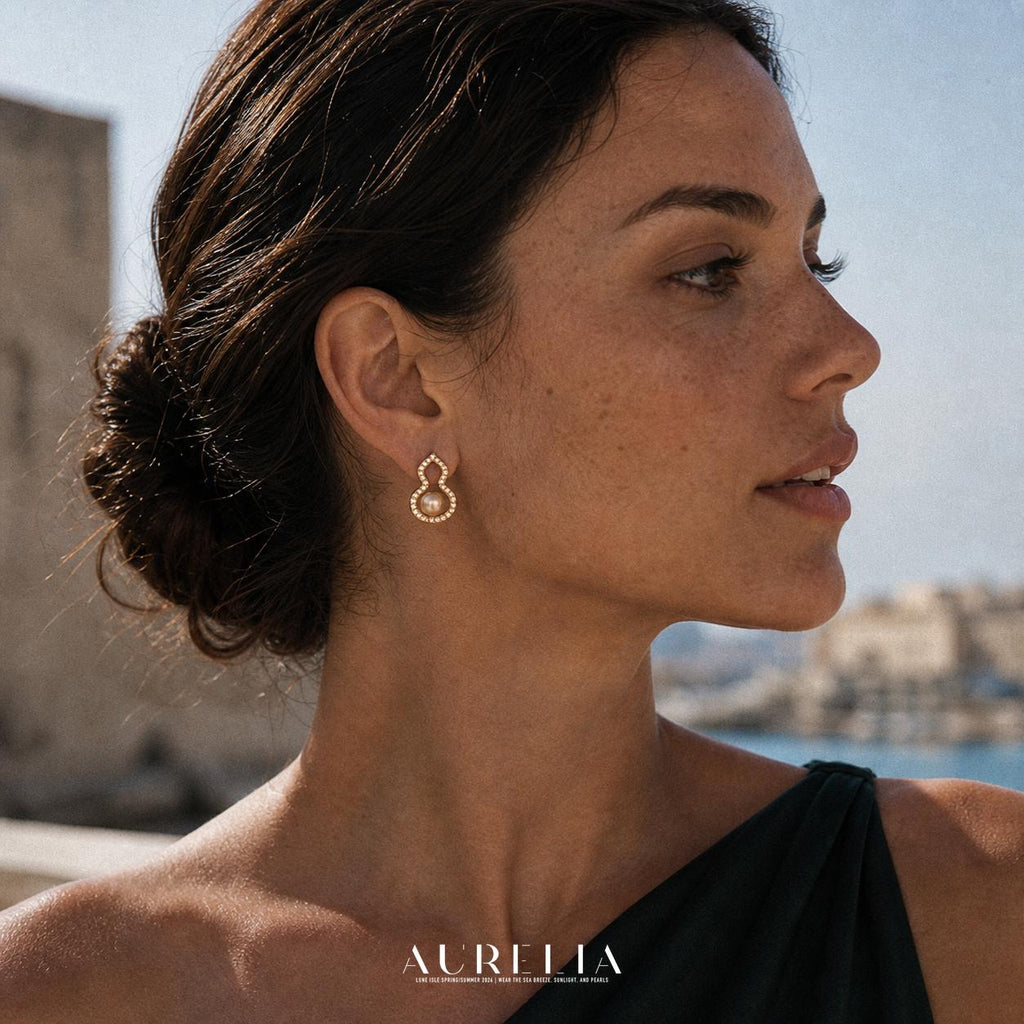 Side portrait with the same clear-accent double-lobed outline and one warm pale bead.