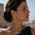 Side portrait with the same clear-accent double-lobed outline and one warm pale bead.