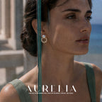 Close portrait beside glass pane with matching white top bead and open alternating-bead garland.