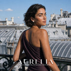 Over-shoulder rooftop portrait with the rounded triangle, divided white panels and center bead visible.