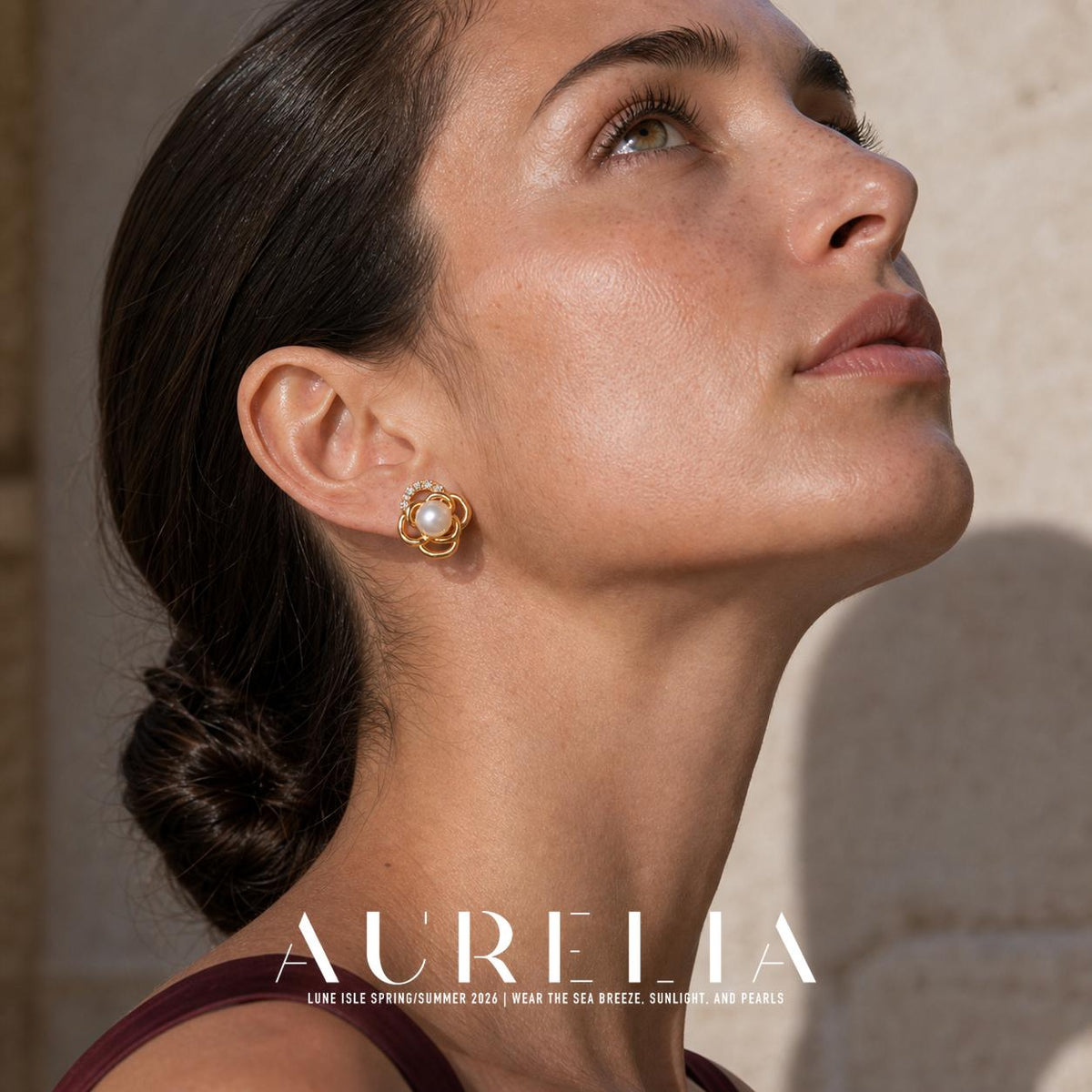 Close upward-looking portrait with nested flower loops, white center bead and clear-accent top arc.