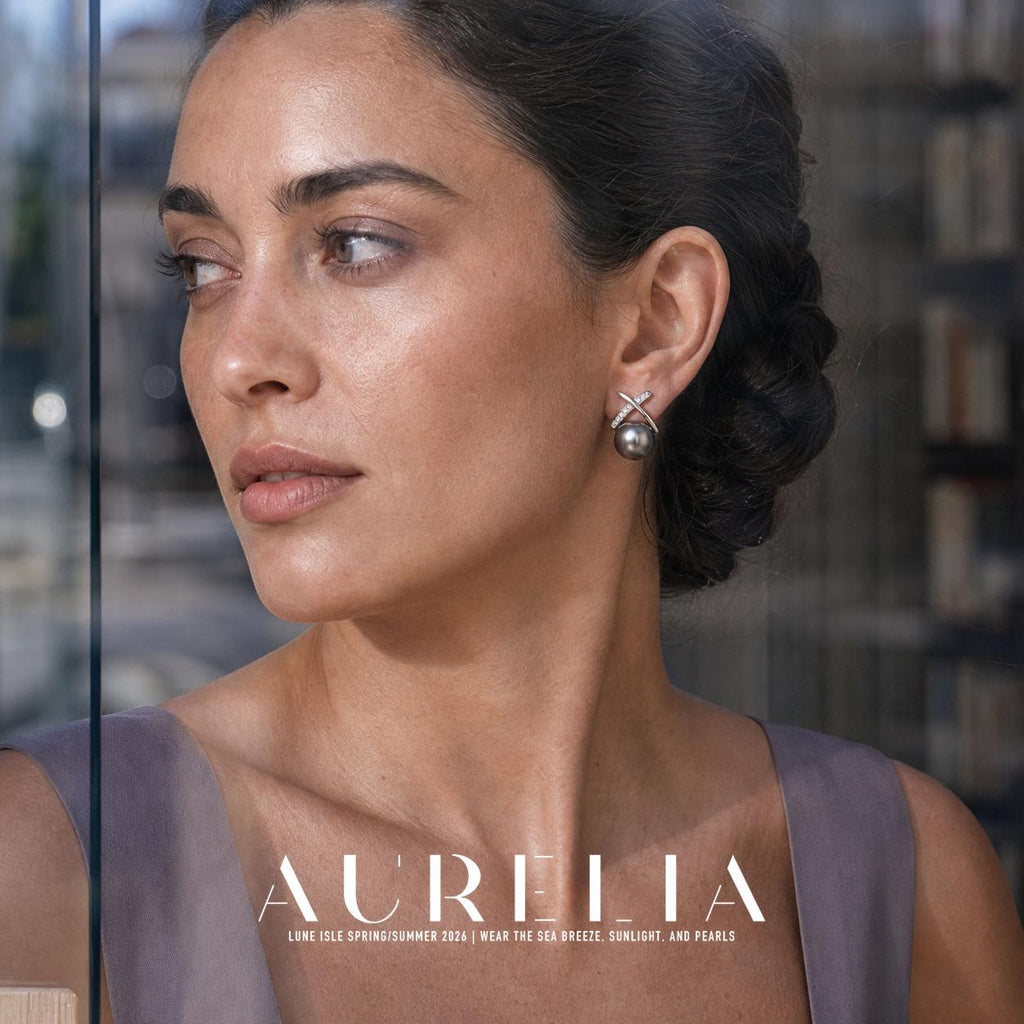 Close portrait beside glass showing smooth and accent-studded crossed bars with dark gray bead.