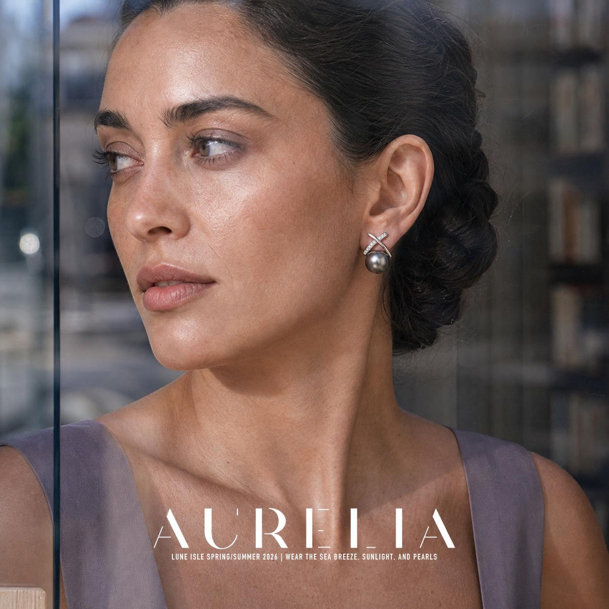 Close portrait beside glass showing smooth and accent-studded crossed bars with dark gray bead.