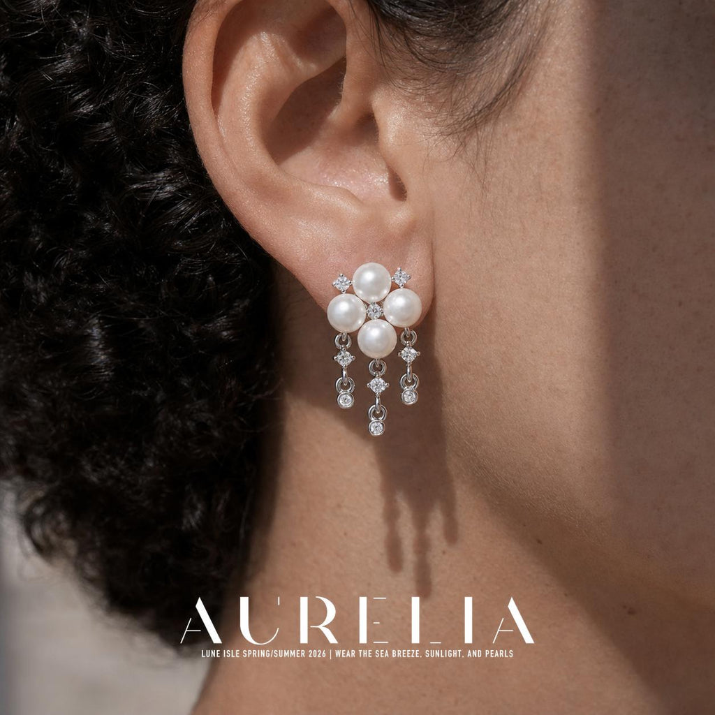 Close ear view showing the four-bead cluster and all three dangling chains.