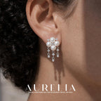 Close ear view showing the four-bead cluster and all three dangling chains.