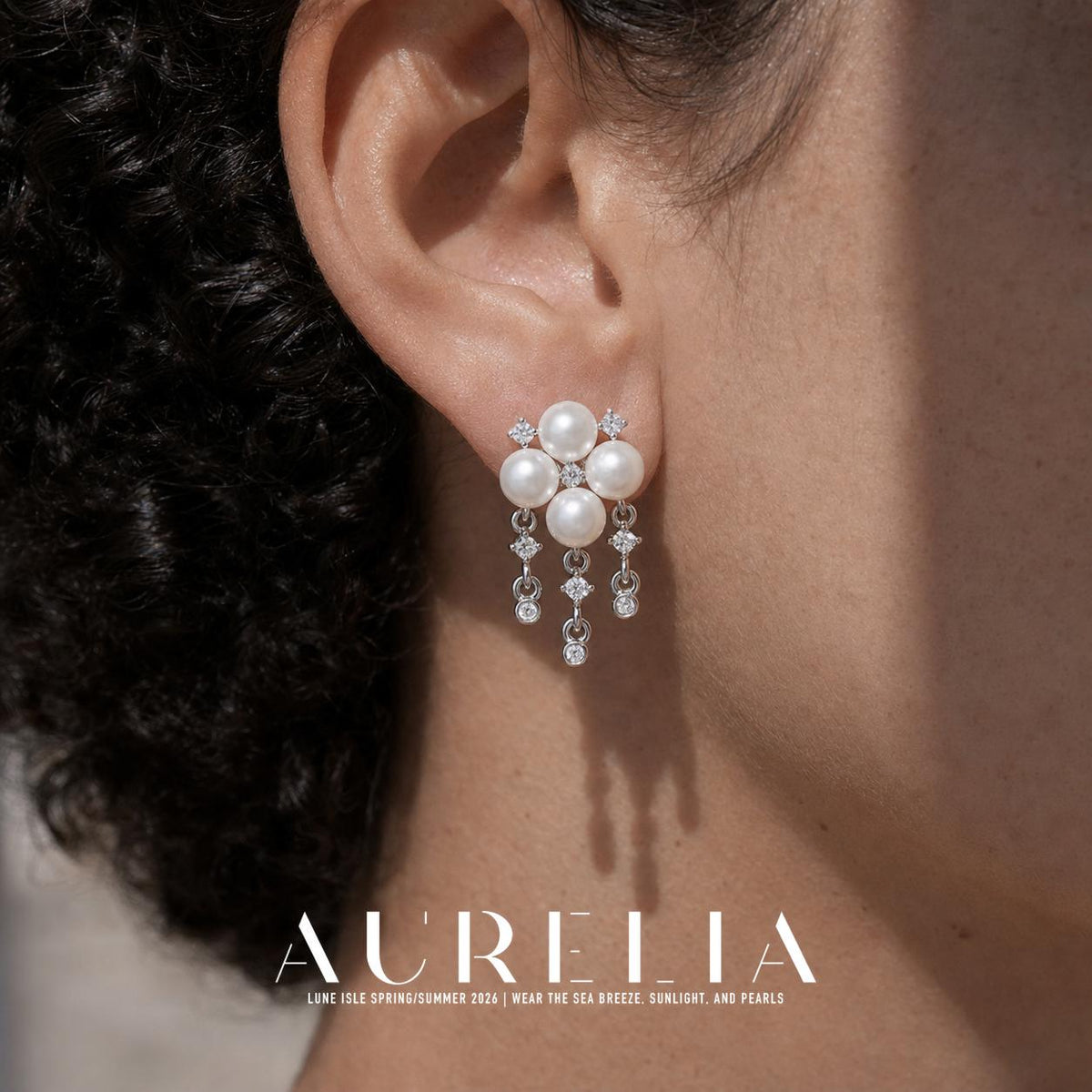 Close ear view showing the four-bead cluster and all three dangling chains.