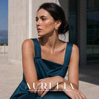 Seated model in a teal dress with the same gold-colored firework design visible.