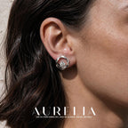 Close ear view clearly showing the twisted circular border and lower clear stone.