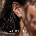 Close ear view of the interlaced loop stud and its central round clear stone.