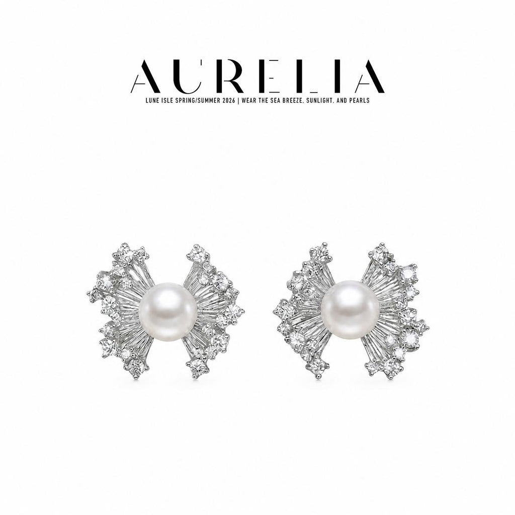 Studio pair in silver tone with round center beads and fan-shaped bow wings tipped with clear stones.