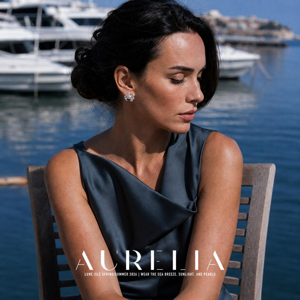 Seated marina portrait in dark blue, showing the silver-tone bow stud on the exposed ear.