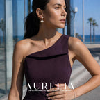 Waist-up portrait in purple with matching bead-and-fan earring visible.