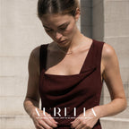 Downward-looking portrait provides a relaxed neckline angle on the same single pale strand.