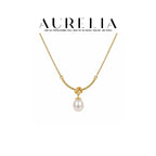 Love Knot Freshwater Pearl Pendant Necklace — supplied AURELIA product photograph.