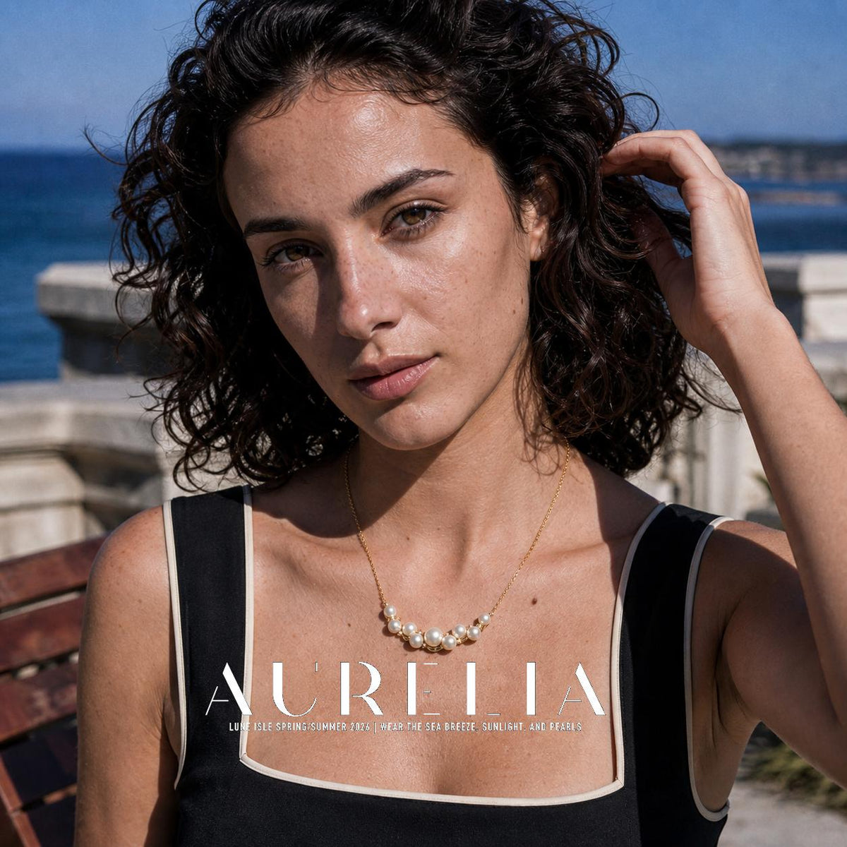 Hand-in-hair portrait with matching nine-bead curved cluster necklace clearly visible.