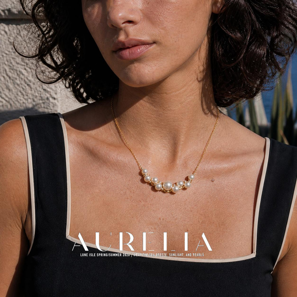 Close chest crop showing the curved white-bead cluster and chain.