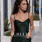 Wider standing portrait in a green dress with the same bar and three-bead pendant visible.
