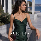 Wider standing waterfront portrait in green, with three white beads below the horizontal necklace bar.