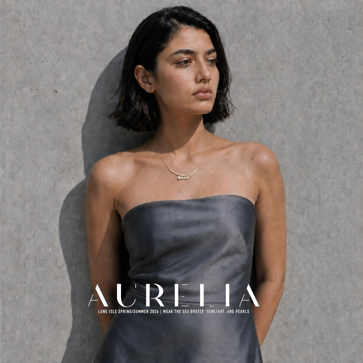 Additional model portrait wearing the double-curve pearl necklace; prior original inspection retained.