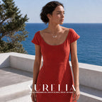 Wider seaside portrait in a red dress with the matching asymmetric beaded/star necklace.