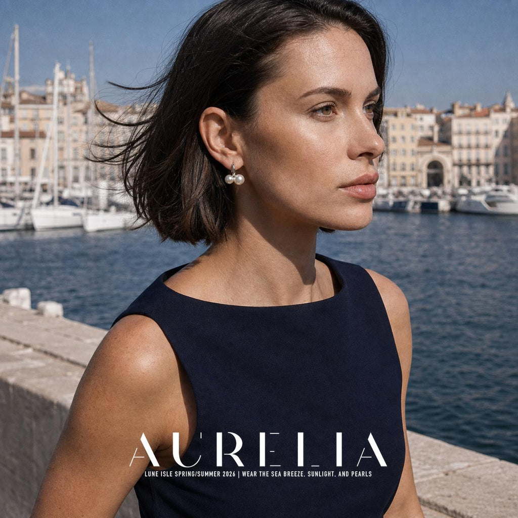 Model at marina wearing silver-tone hoops with paired white beads.