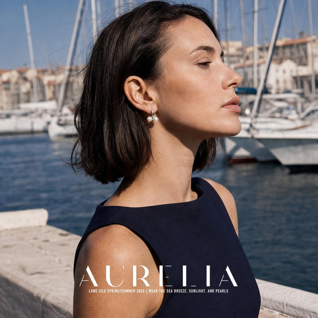 Side-profile model at marina wearing silver-tone hoop with two adjacent white beads.