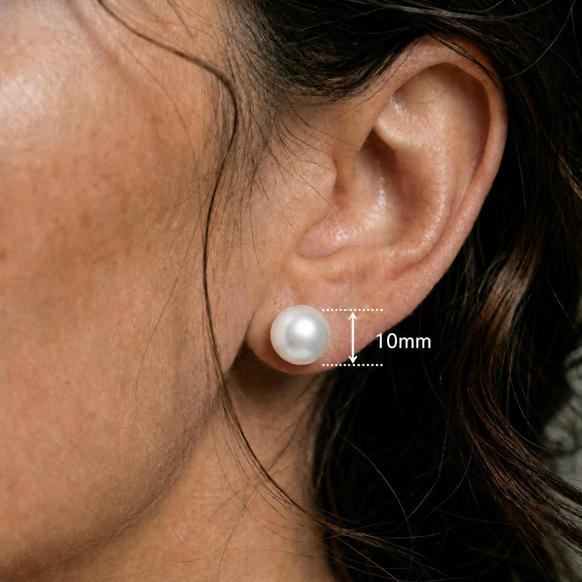 Close ear image showing the matching white round stud with only a 10mm measurement label.
