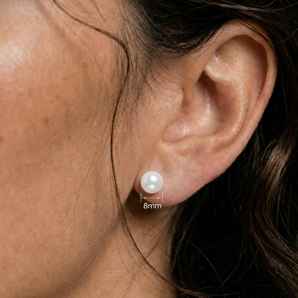 Close ear image showing the matching white round stud with only a 8mm measurement label.