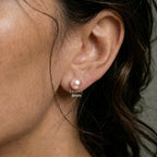 Close ear image showing the matching pink round stud with only a 8mm measurement label.