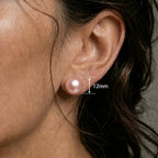 Close ear image showing the matching pink round stud with only a 12mm measurement label.