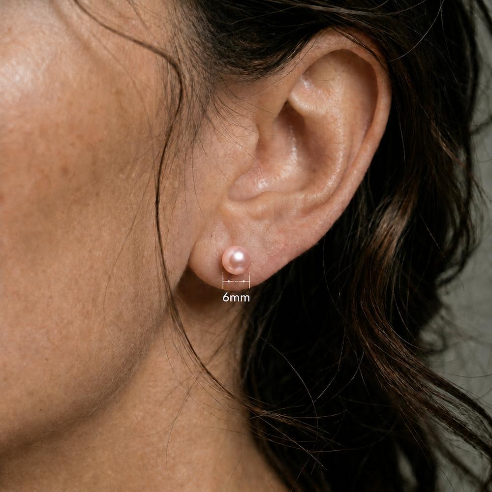 Close ear image showing the matching pink round stud with only a 6mm measurement label.