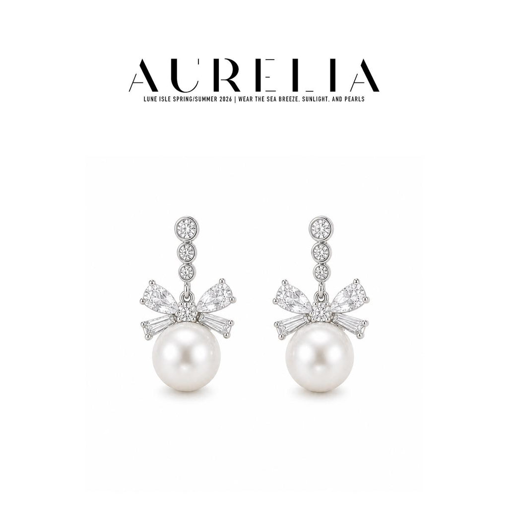 Triple Accent Bow Crystal Pearl Drop Earrings — supplied AURELIA product photograph.
