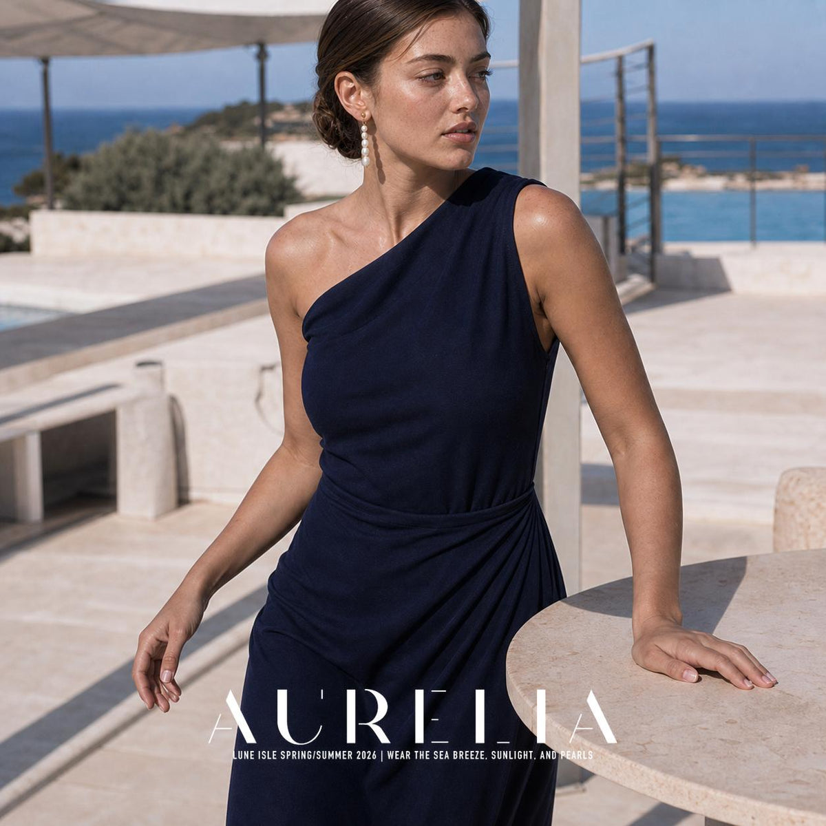 Wider seaside terrace portrait in navy with the matching five-bead drop visible.