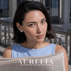 Model holding newspaper, wearing round halo and white-center stud.