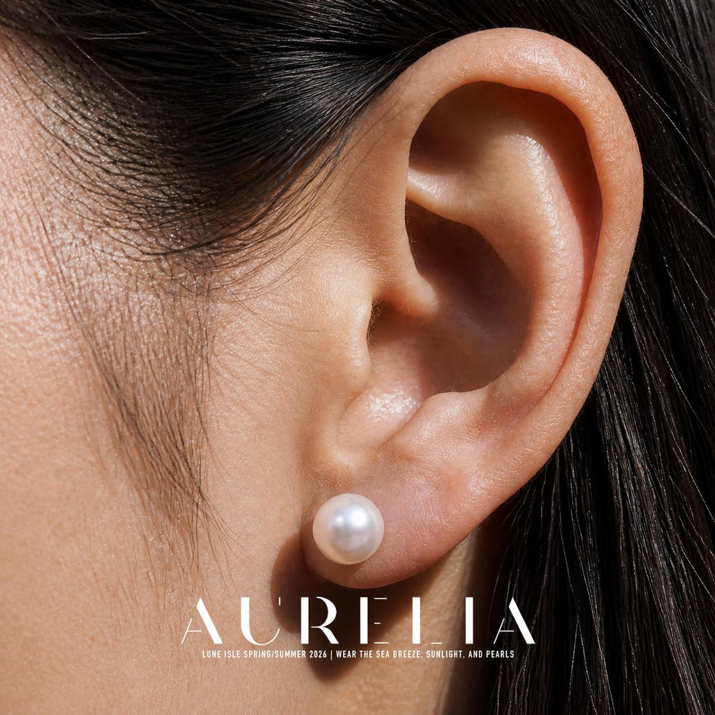 Close ear view showing the plain round white stud.