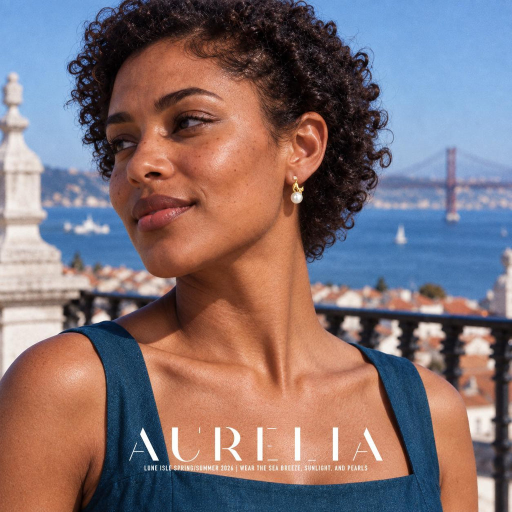 Model portrait in a blue dress with the same stretching-cat earring visible against the waterfront.