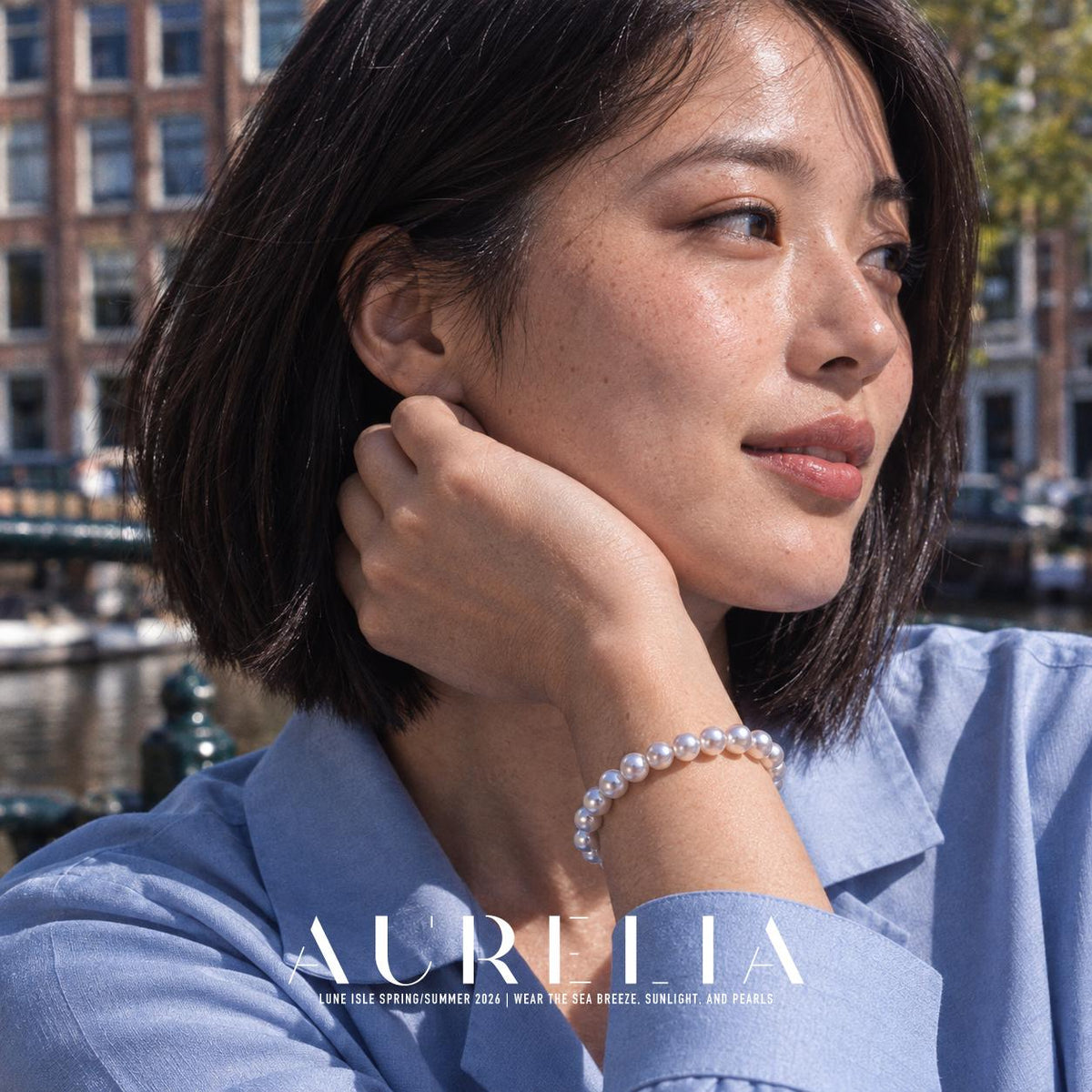 Model resting face against a hand, bracelet visible. Single row of white round beads with a smooth oval silver-colored clasp; the close clasp view matches the main, and other worn views show the same plain strand. No worn photo is assigned to an exclusive size variant.
